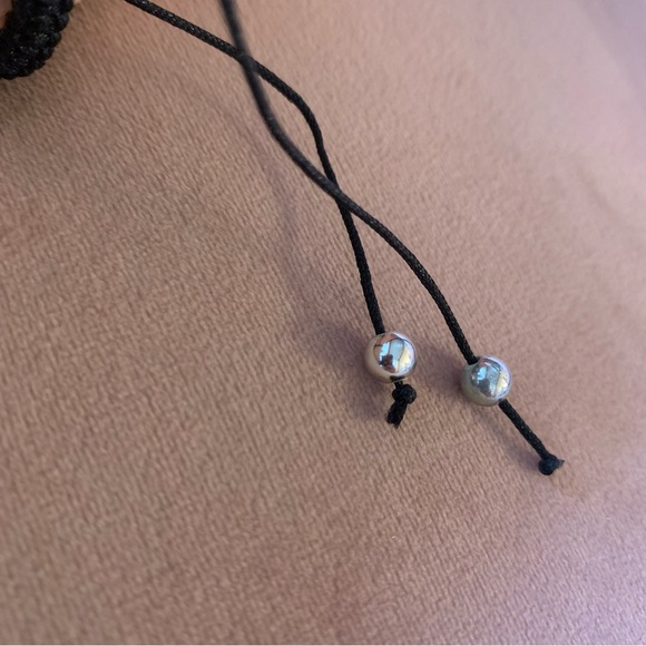 Simple multicolore bracelet with skull and black cord. - Picture 7 of 8